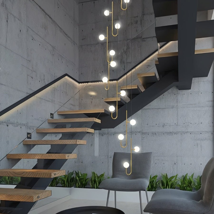 Lexto Indoor Chandelier by Residence Supply with multiple glass shades and elegant metal frame, ideal for living room lighting.