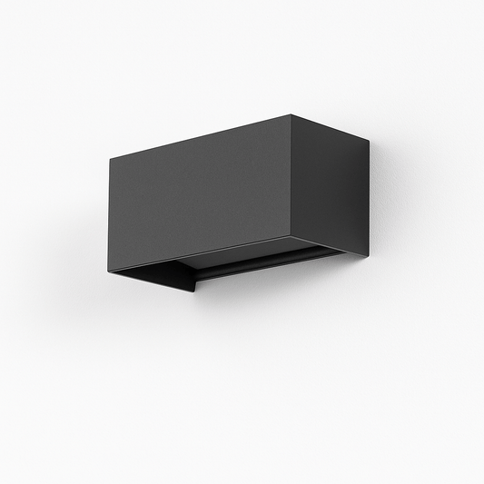 Licht outdoor wall lamp by Residence Supply, showcasing a sleek design with warm light in an outdoor setting.