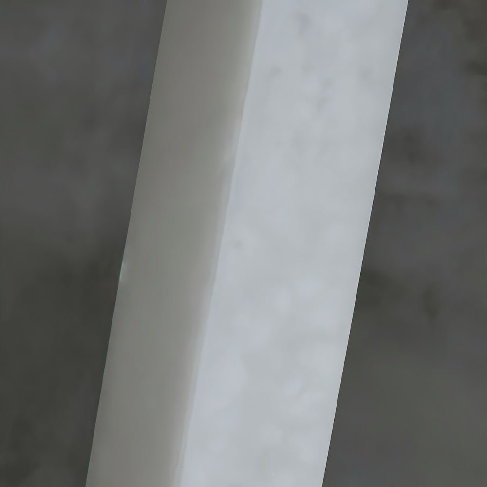 Lifang table lamp by Residence Supply featuring a sleek design with a white shade and wooden base on a modern desk.