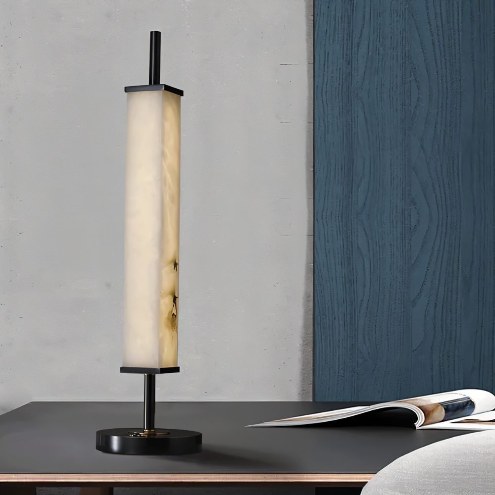 Lifang Table Lamp by Residence Supply featuring a modern design with a white fabric shade and wooden base on a bedside table.