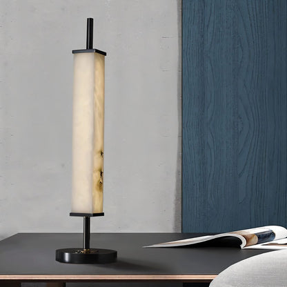 Lifang Table Lamp by Residence Supply featuring a modern design with a white fabric shade and wooden base on a bedside table.
