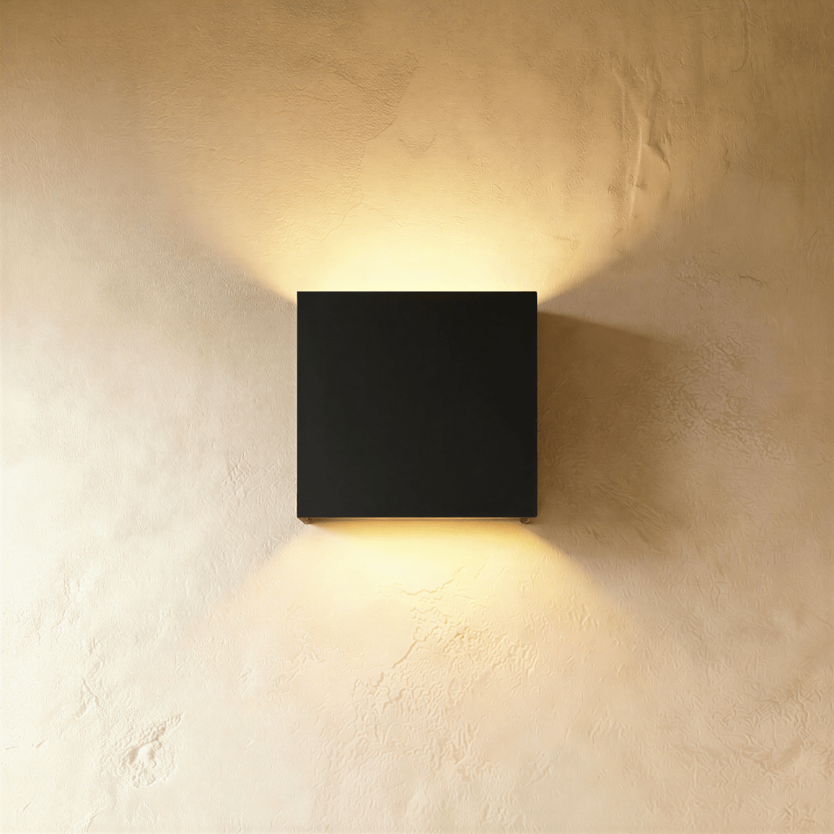 Modern Lior Wall Lamp by Residence Supply featuring a sleek metal design and warm ambient lighting.