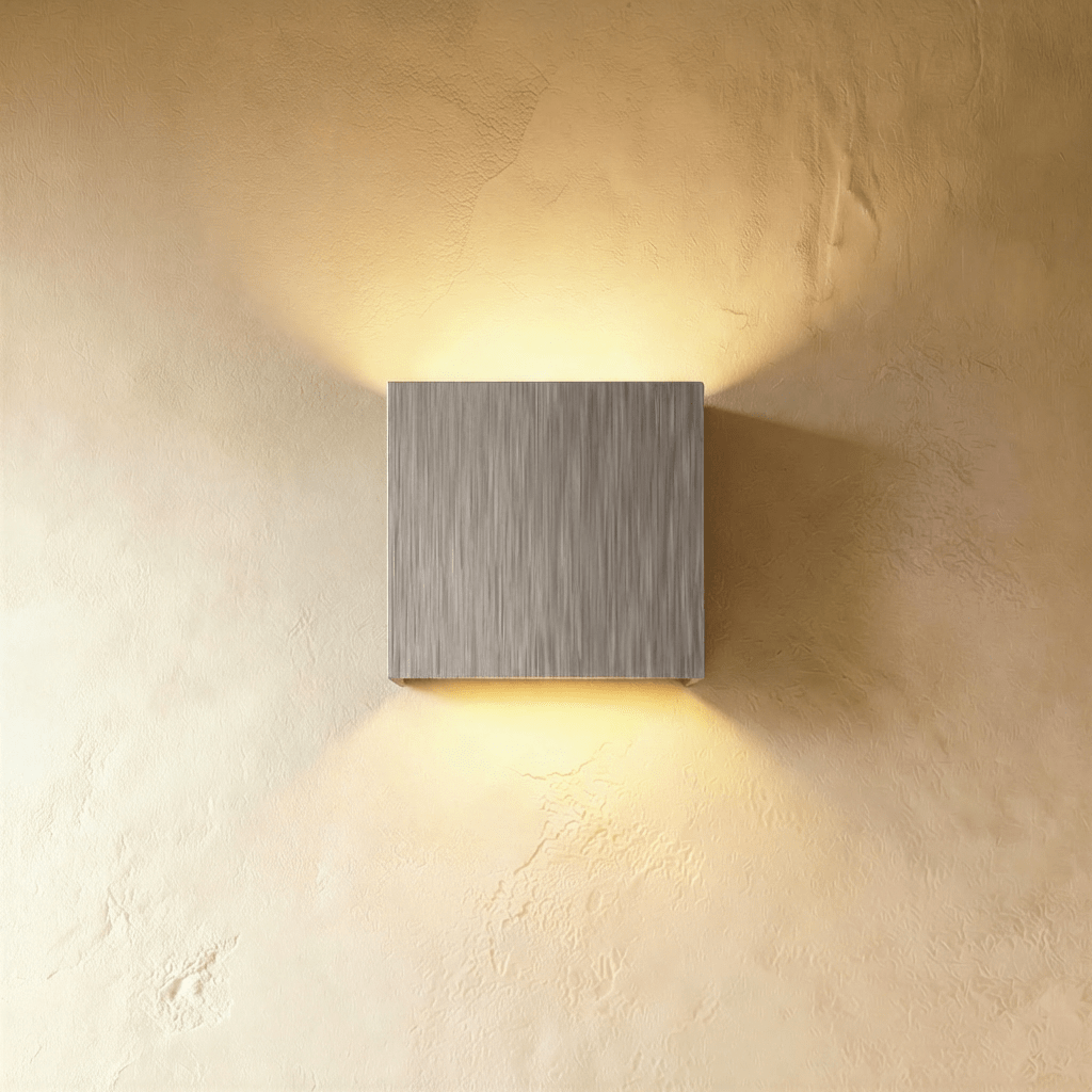 Modern Lior Wall Lamp by Residence Supply featuring sleek design with a cylindrical shade mounted on a wall bracket.