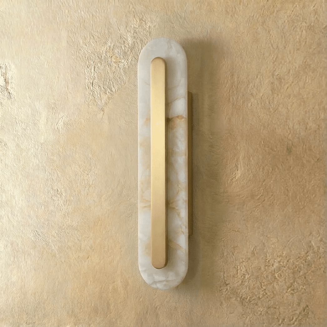 Residence Supply Lofos wall lamp with a sleek, modern design and warm lighting, mounted on a wall for ambient illumination.