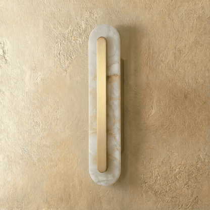 Residence Supply Lofos wall lamp with a sleek, modern design and warm lighting, mounted on a wall for ambient illumination.