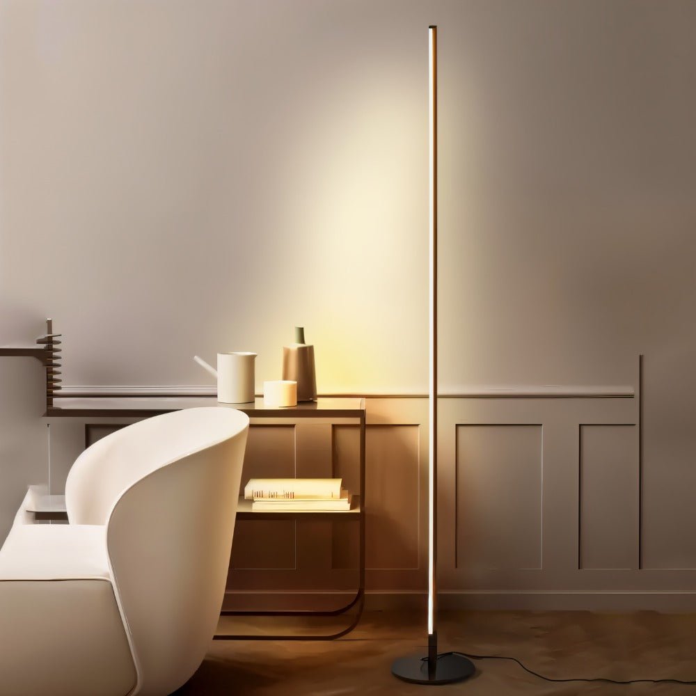 Modern Lotif Floor Lamp by Residence Supply with a sleek design and tall metal stand, ideal for living room or office lighting.