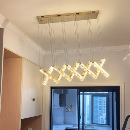 Elegant Lucente chandelier by Residence Supply featuring multiple glass and crystal tiers for a luxurious lighting display.
