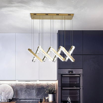 Elegant Lucente chandelier by Residence Supply featuring multiple glass shades and intricate metal detailing.