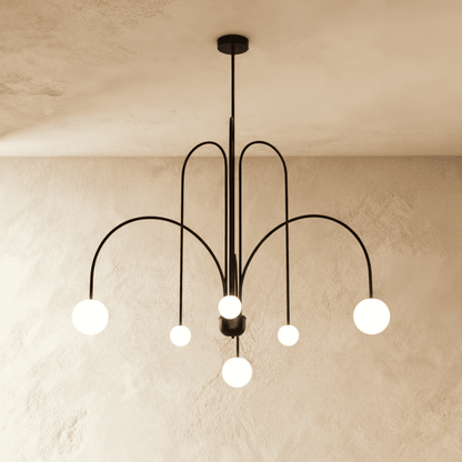 Elegant Lucille Chandelier by Residence Supply with multiple glass pendant lights and a metal frame, ideal for sophisticated interiors.