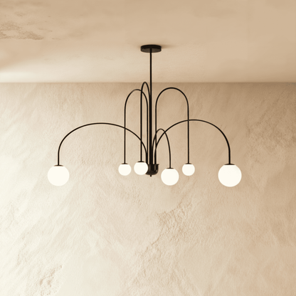 Elegant Lucille Chandelier by Residence Supply featuring multiple glass globes and a sleek metal frame for modern lighting.