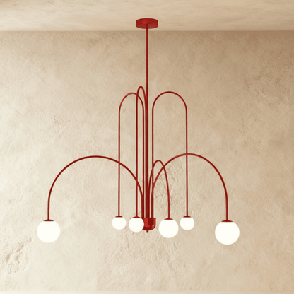 Elegant Lucille Chandelier by Residence Supply with crystal accents and multiple light bulbs, hanging from a decorative metal frame.