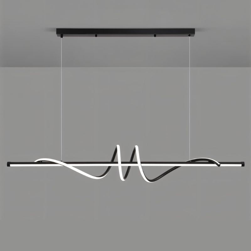 Black Lumexis Pendant Light by Residence Supply hanging from ceiling with modern design and sleek finish.