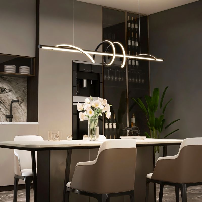Lumexis pendant light hanging above a dining table in a modern dining room, featuring sleek design and warm lighting.