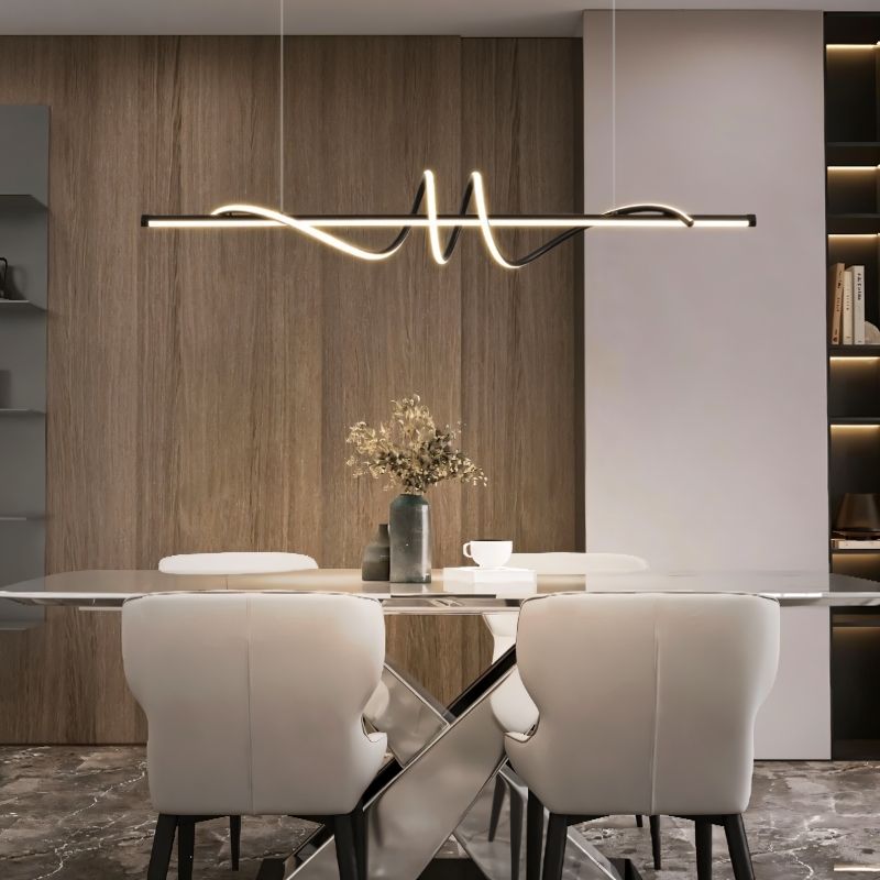Lumexis pendant light hanging above dining table, modern design with sleek metal finish in a contemporary dining room setting.