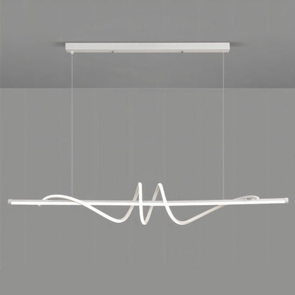 White Lumexis pendant light by Residence Supply hanging from ceiling with a modern design.