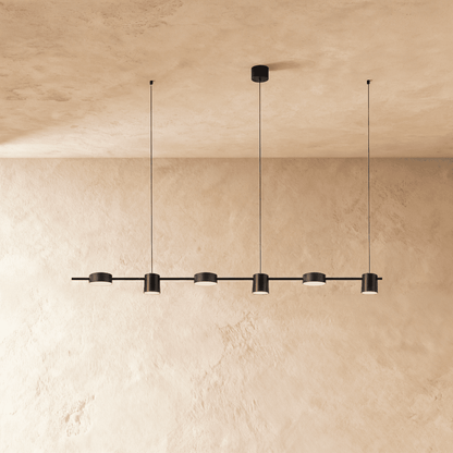 Elegant Lumina Luxe Chandelier by Residence Supply with crystal accents and a modern silver finish, hanging in a stylish living room.