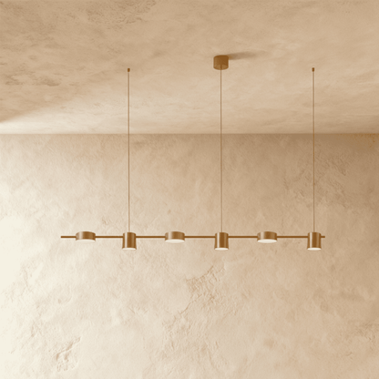 Elegant Lumina Luxe Chandelier by Residence Supply with crystal accents and modern design, hanging from a ceiling with warm lighting.
