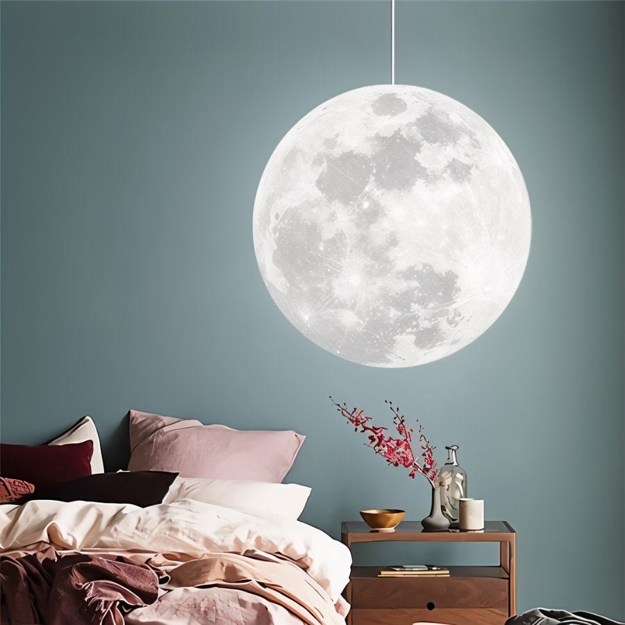 Residence Supply Lunar Pendant Light hanging fixture with a sleek, modern design, featuring a round, moon-inspired shape and soft illumination.