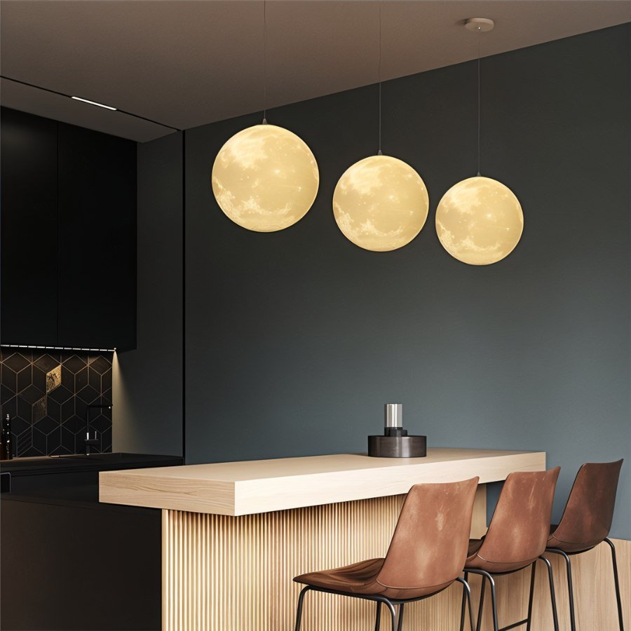 Residence Supply lunar pendant light hanging from ceiling, featuring a round moon-inspired design with soft ambient glow.