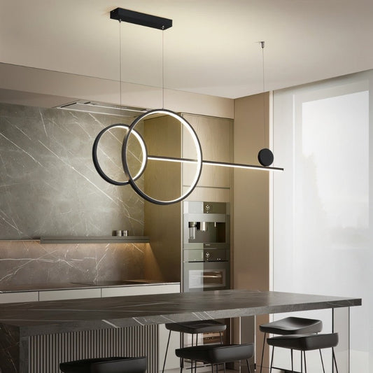 Lyzaro Pendant Light by Residence Supply featuring a modern, sleek design with a metal finish and clear glass shade.
