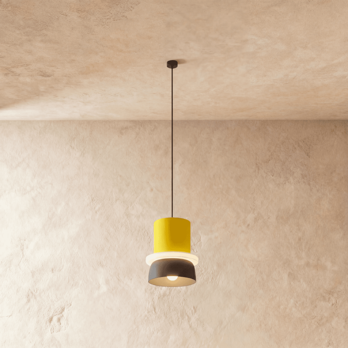 Residence Supply macaron pendant light with a pastel-colored, round ceramic shade hanging from a sleek metal fixture.