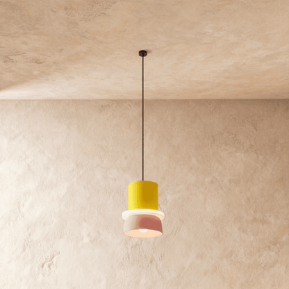 Residence Supply Macaron Pendant Light showcasing a pastel-colored, round ceramic design hanging from a metal fixture.