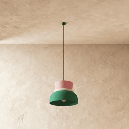 Residence Supply Macaron Pendant Light featuring a pastel-colored, rounded ceramic shade hanging from a sleek metal fixture.