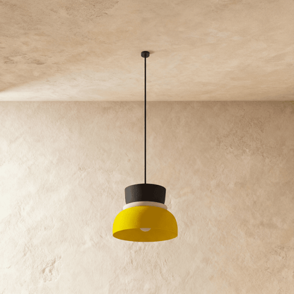 Residence Supply macaron pendant light with a pastel-colored, rounded shade hanging from a ceiling mount.