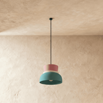 Residence Supply Macaron Pendant Light with pastel-colored, rounded glass shade hanging from a sleek metal fixture.
