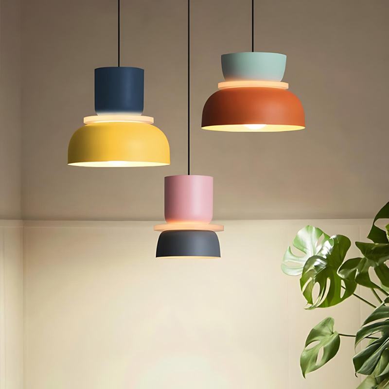 Residence Supply Macaron Pendant Light featuring a pastel-colored, rounded ceramic shade hanging from a sleek metal fixture.