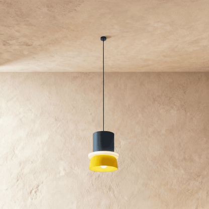 Residence Supply macaron pendant light with pastel-colored, rounded ceramic shade hanging from a modern ceiling fixture.