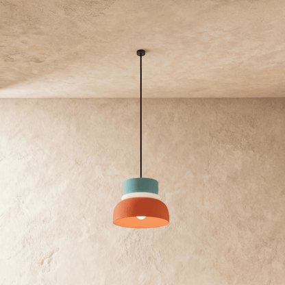 Residence Supply Macaron Pendant Light with pastel-colored, rounded ceramic shade hanging from a metal fixture.