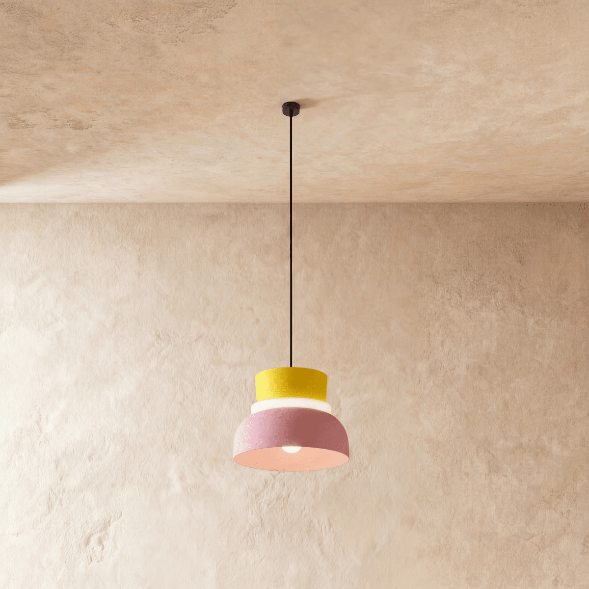 Residence Supply Macaron Pendant Light featuring a pastel-colored, rounded ceramic shade hanging from a sleek metal fixture.
