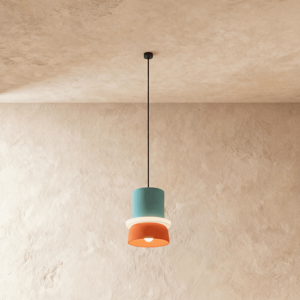 Residence Supply Macaron Pendant Light with pastel-colored, round ceramic shade hanging from a metal fixture.