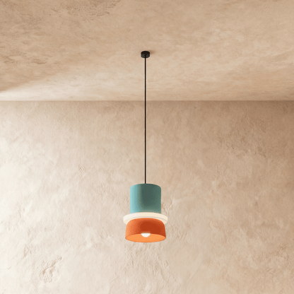 Residence Supply Macaron Pendant Light with pastel-colored, round ceramic shade hanging from a metal fixture.