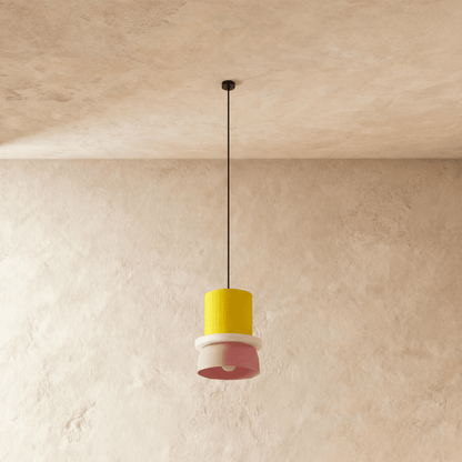 Residence Supply Macaron Pendant Light with pastel-colored, rounded shade hanging from a ceiling mount.