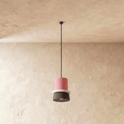 Residence Supply Macaron Pendant Light featuring a pastel-colored, round ceramic shade hanging from a sleek metal fixture.