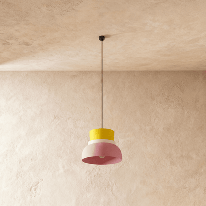 Residence Supply Macaron Pendant Light with pastel-colored, round ceramic shade hanging from a sleek ceiling mount.