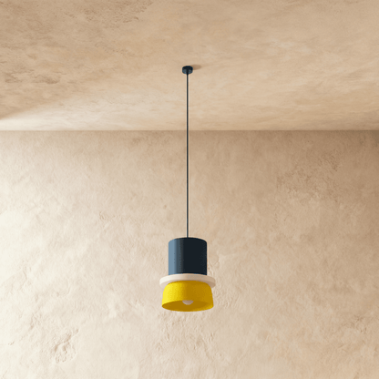 Residence Supply macaron pendant light with pastel-colored, rounded ceramic shade hanging from a ceiling mount.