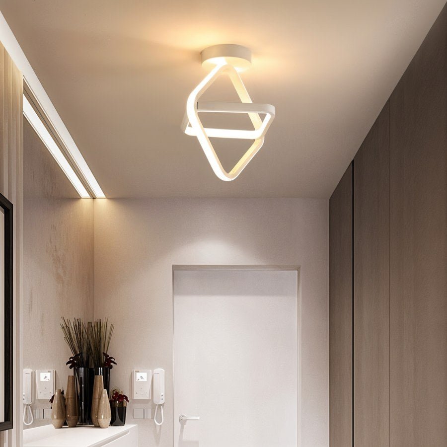 Modern Manaia Ceiling Light by Residence Supply featuring intricate metal design and warm ambient lighting.