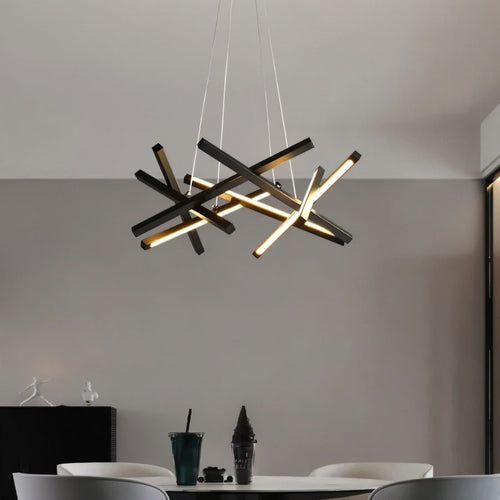 Elegant Maseu Chandelier by Residence Supply with multiple glass bulbs and intricate metal frame, hanging from a ceiling.