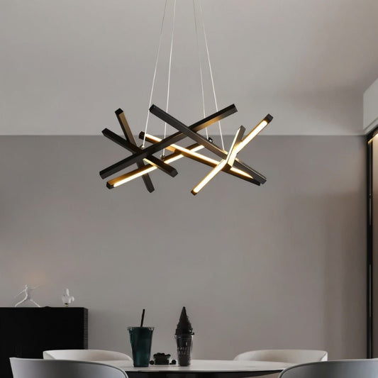 Elegant Maseu Chandelier by Residence Supply with multiple glass bulbs and intricate metal frame, hanging from a ceiling.