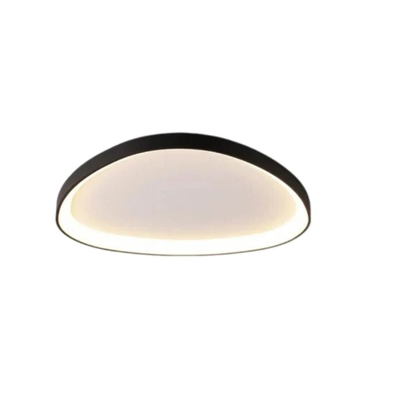 Mila Ceiling Light by Residence Supply featuring a modern design with a sleek metal finish and ambient lighting.