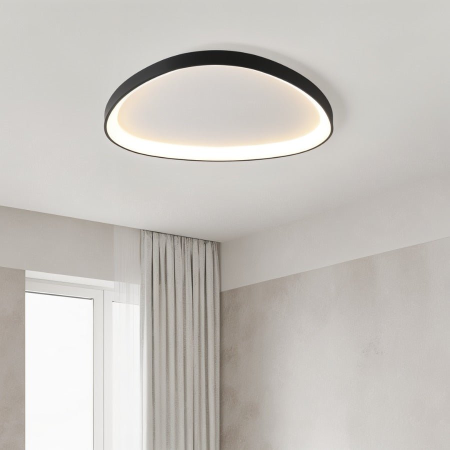 Mila ceiling light by Residence Supply featuring a modern design with a sleek metal finish and glass shade for contemporary interiors.