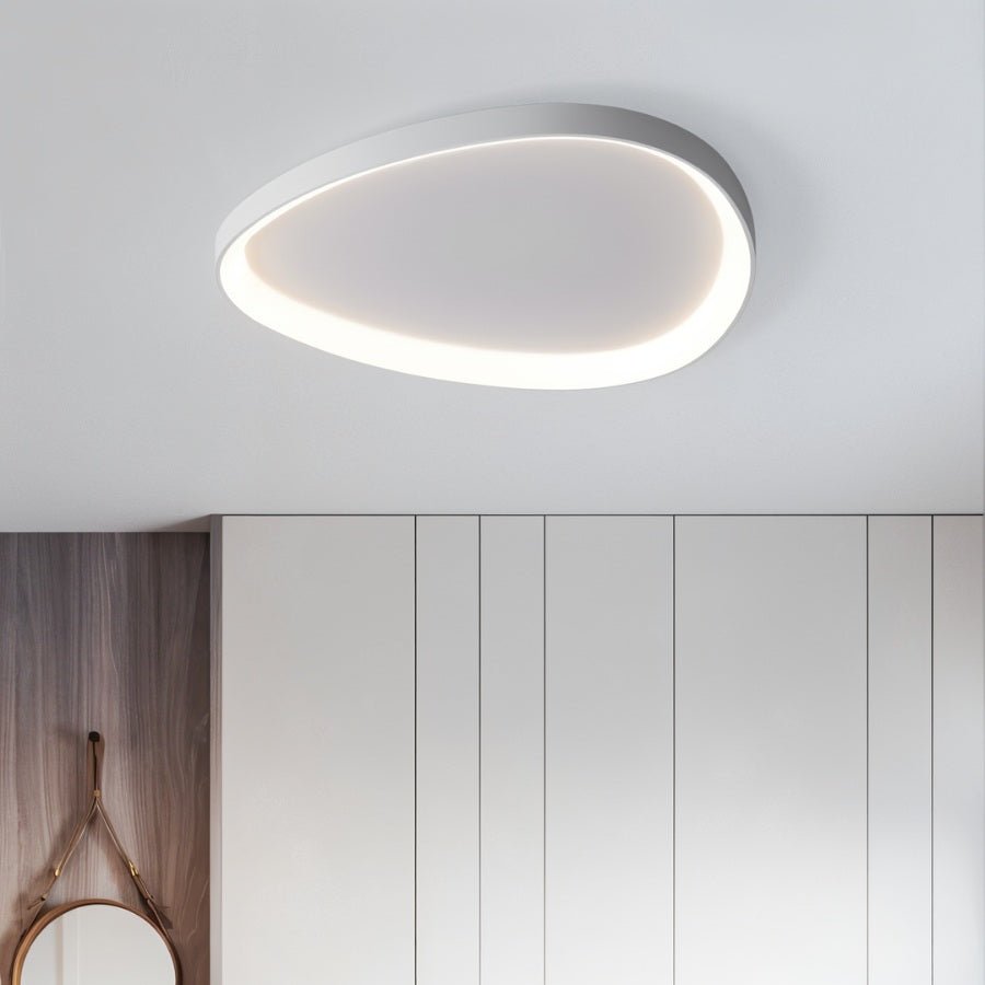 Modern Mila ceiling light by Residence Supply with sleek design and soft white illumination for living rooms and bedrooms.