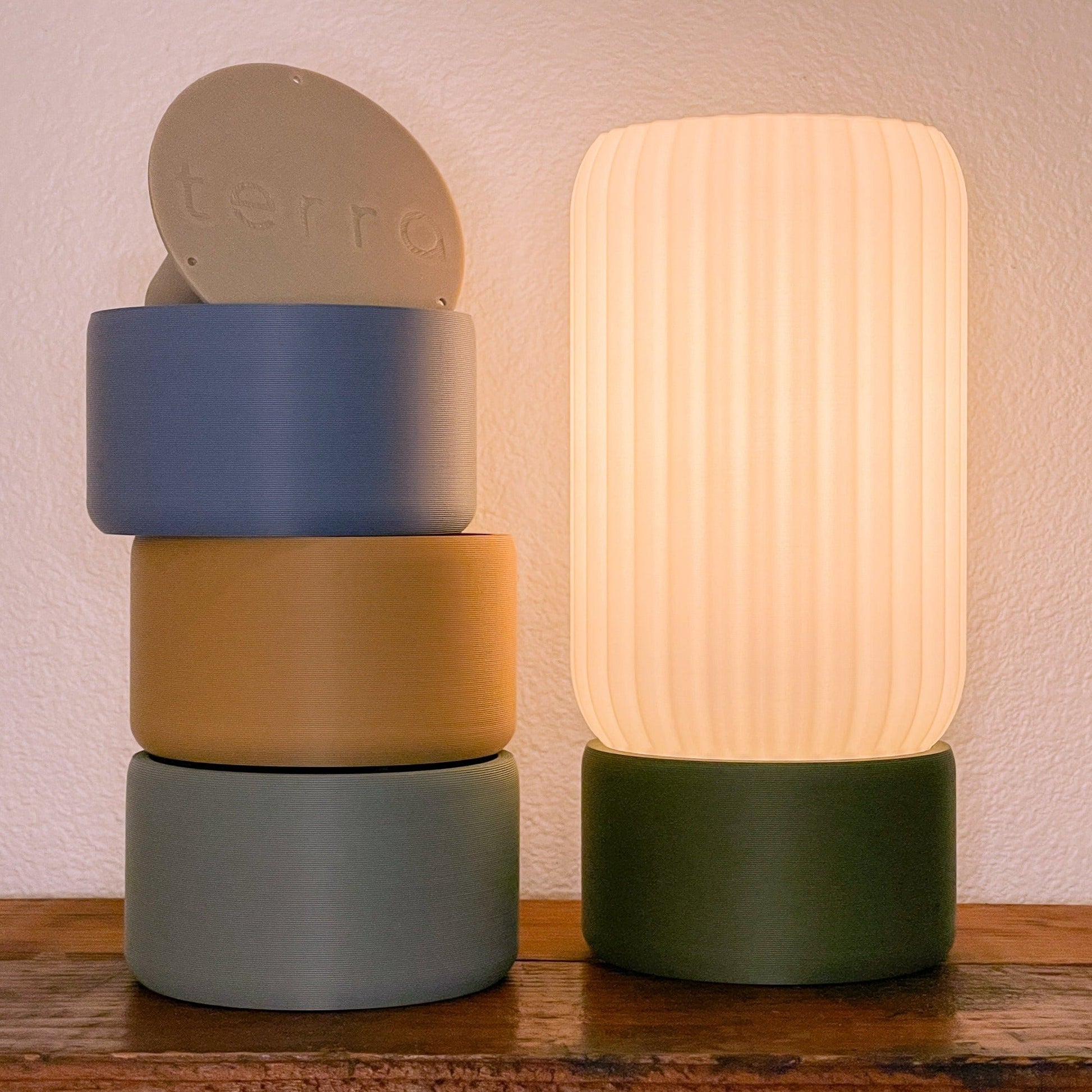 Terra Labs Milk Shade Barrel Table Lamp with white ceramic base and cream fabric shade, modern lighting for living spaces.