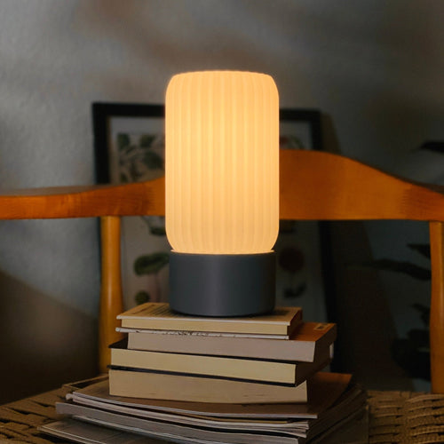 Terra Labs Milk Shade Barrel Table Lamp with white milk-glass shade and wooden base, ideal for living room or bedside decor.