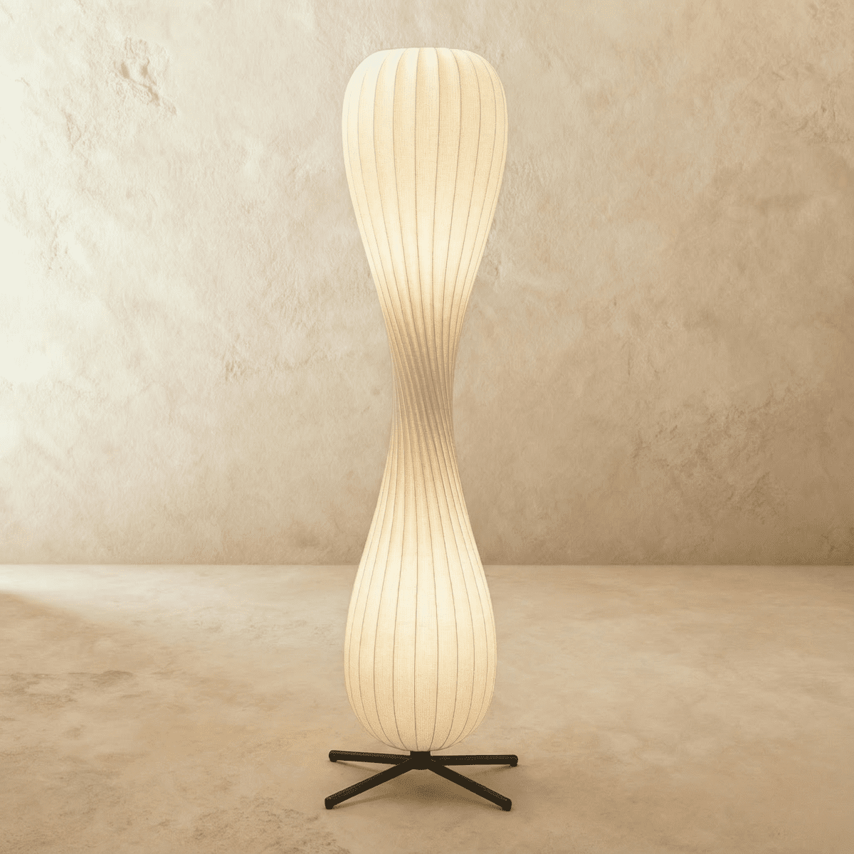 Modern Twist Floor Lamp by Residence Supply with a sleek, contemporary design and a curved metal stand.