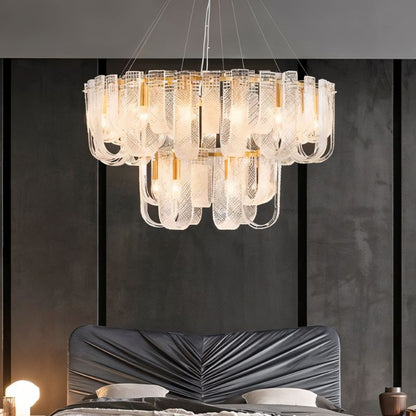 Elegant Mudil Tier Chandelier by Residence Supply featuring multiple tiers of hanging lights and intricate metalwork.