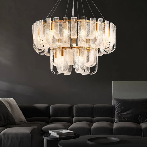 Residence Supply Mudil Tier Chandelier with multiple tiers and intricate metal design hanging from a ceiling fixture.